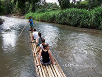 bamboo rafting along the river 