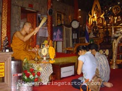 Morning Arm Giving- Doi Suthep Temple 