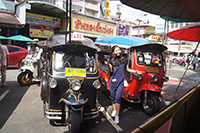 Travel by Tuk Tuk, a These three-wheeled vehicles