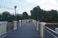 we will take a leisurely walk along The Chansom Memorial Foot Bridge, a bridge connecting the Wat Ket neighborhood with Kad Luang