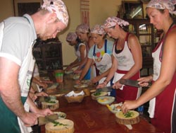 learn how to cook real Thai food in a traditional Thai setting