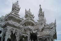 Visit  White Temple. Wat Rong Khun is unique from other temples as it is white in color. Combine the white with glass mosaics and this Temple sparkles! 