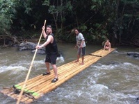 enjoy bamboo rafting along the river